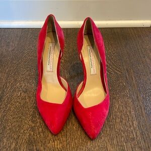 Red suede pumps